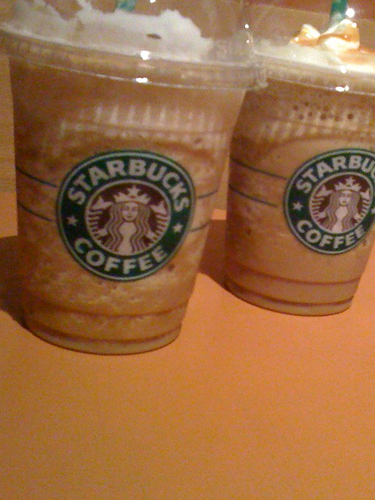 2 iced coffees with whipped cream from starbucks